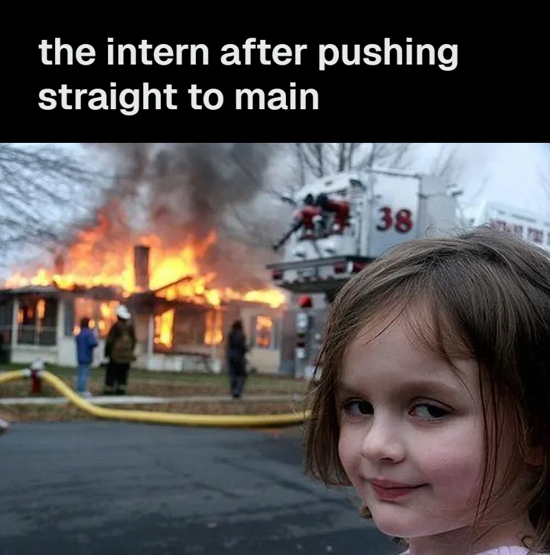 Disaster Girl smiling in front of a burning house, with a black bar above it reading: the intern after pushing straight to main